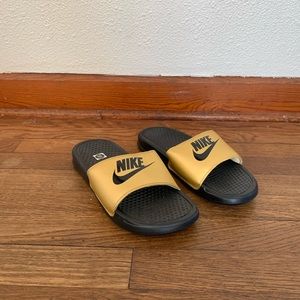 gold Nike slides